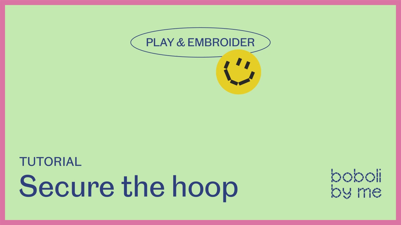 Charger la vidéo: Hands adjusting a wooden embroidery hoop with fabric inside, tightening the surface for comfortable stitching.